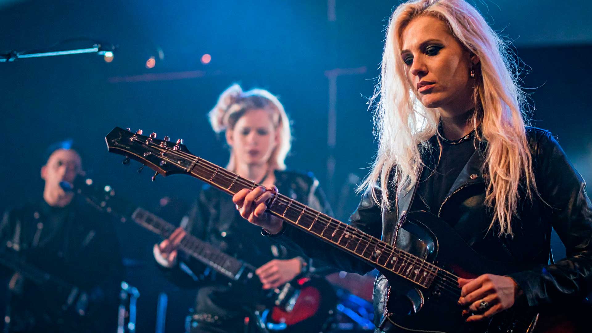 image female metal band performing on stage